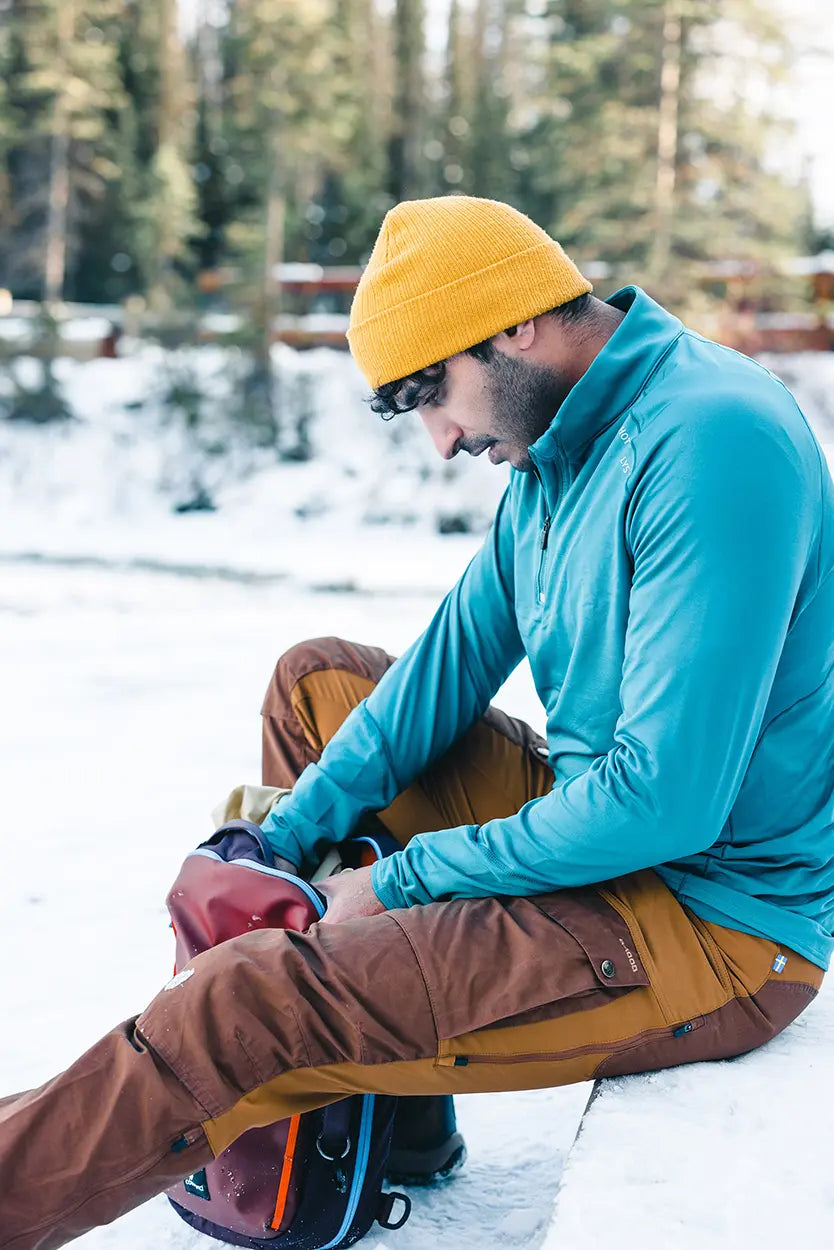 Man wearing Hot Chillys thermal base layers during a winter hike